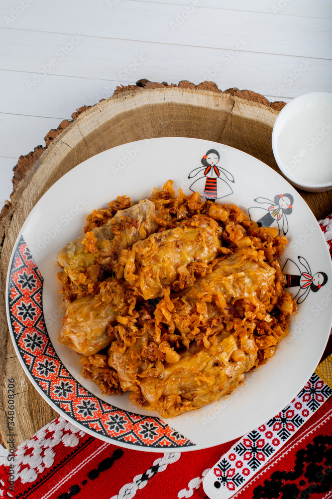 Sarma is a dish of vine, cabbage rolls stuffed with minced meat. Traditional romanian, greek Sarma is a dish of vine, cabbage rolls stuffed with minced meat. Traditional romanian, greek