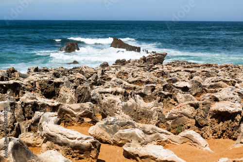 Fishermen's route in the Alentejo, promenade with cliffs in Portugal. Wooden walkway along the coastline.