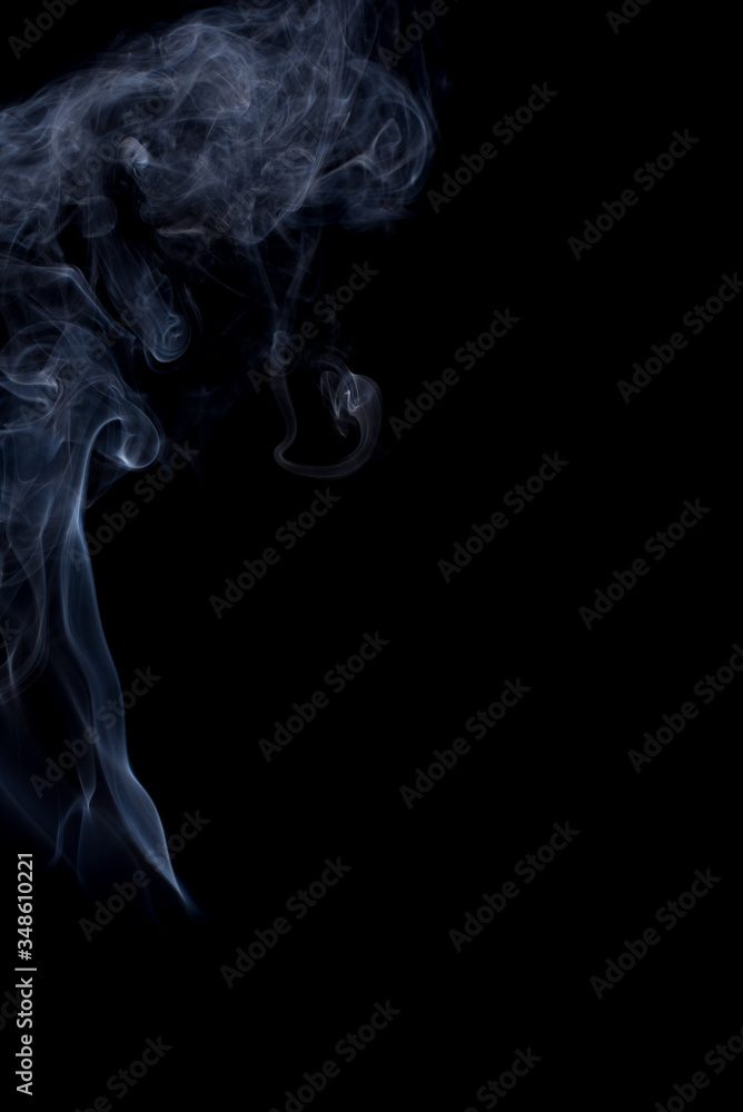 The movement of the smoke on a black background . The movement of the smoke on a black background .