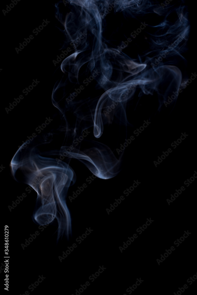The movement of the smoke on a black background . The movement of the smoke on a black background .