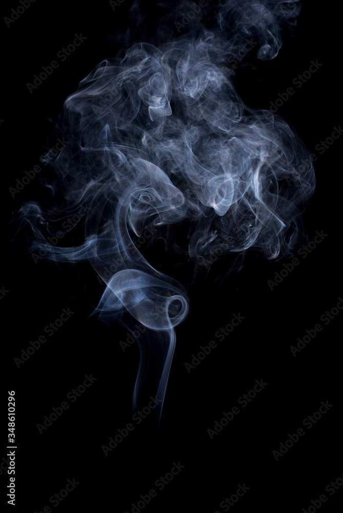 The movement of the smoke on a black background . The movement of the smoke on a black background .