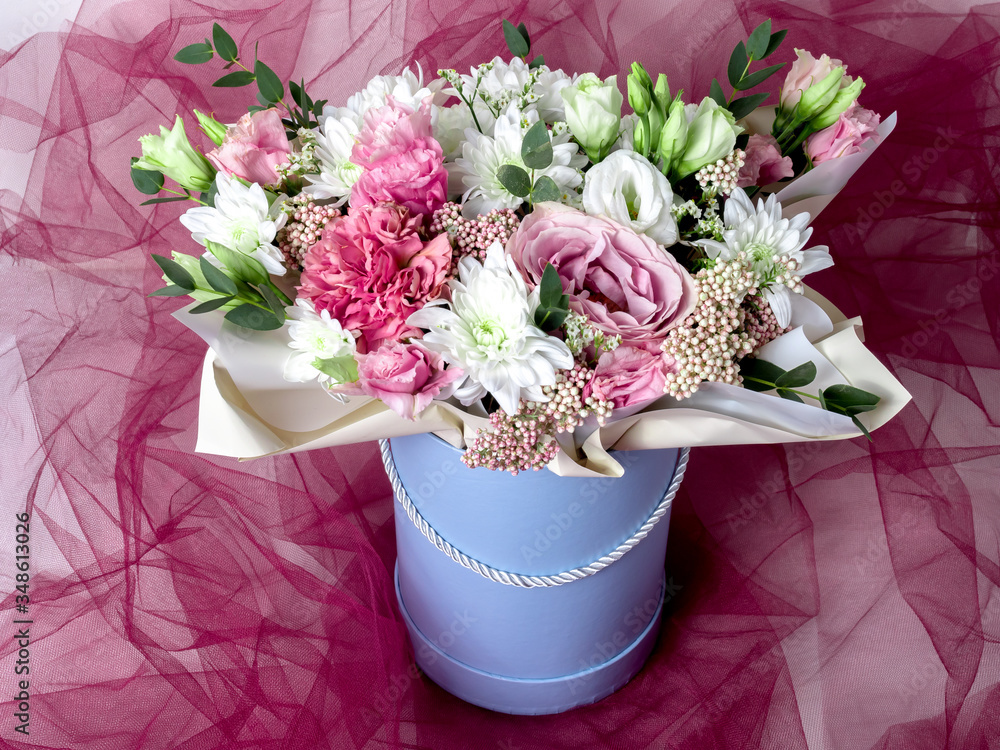 flowers in a box with red tulle flowers in a box with red tulle