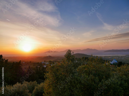 Romantic sunset over the island kos in greece with bright colors in the sky