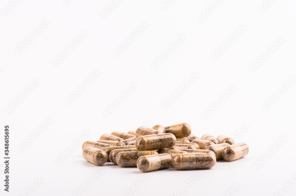 Capsules with medicine or vitamins on a white background. Health concept. Capsules with medicine or vitamins on a white background. Health concept.