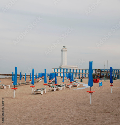 Beach huts at a beach resort on the southern Italian coast out of season with no bathers or sun worshippers
 photo