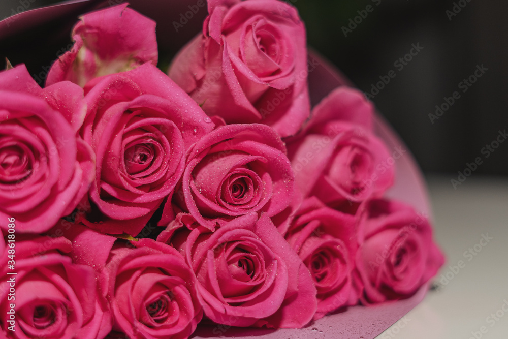 Fototapeta premium bouquet of pink roses with water droplets