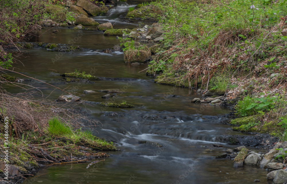 Lomna river in Trojanovice village in spring hot day Lomna river in Trojanovice village in spring hot day