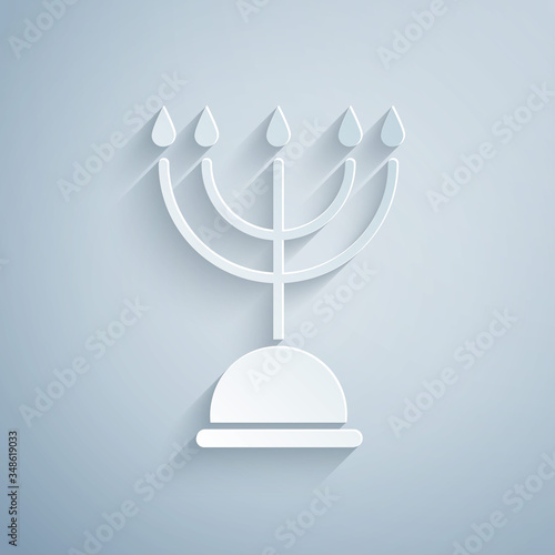 Paper cut Hanukkah menorah icon isolated on grey background. Hanukkah traditional symbol. Holiday religion, jewish festival of Lights. Paper art style. Vector