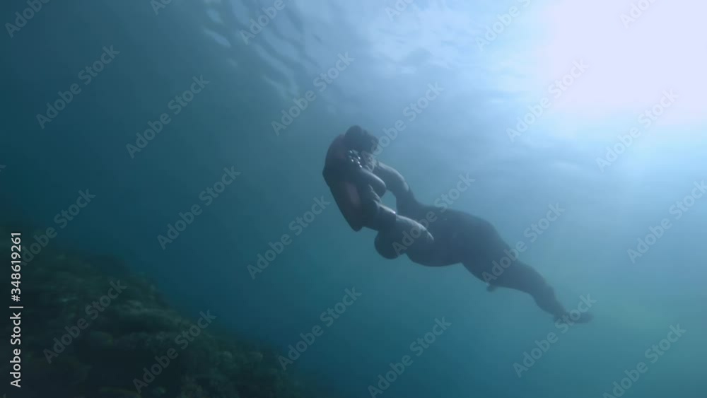 Underwater shoot of young guy snorkeling in tropical sea. Underwater shoot of young guy snorkeling in tropical sea.