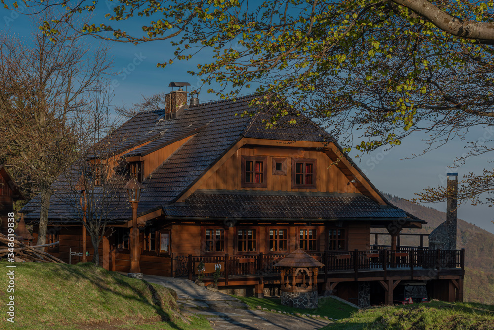 Wooden building in Pustevny in spring sunny nice morning Wooden building in Pustevny in spring sunny nice morning