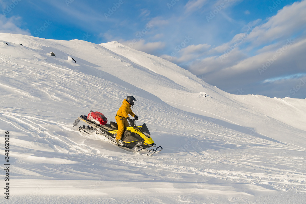 snowmobile in winter in the mountains