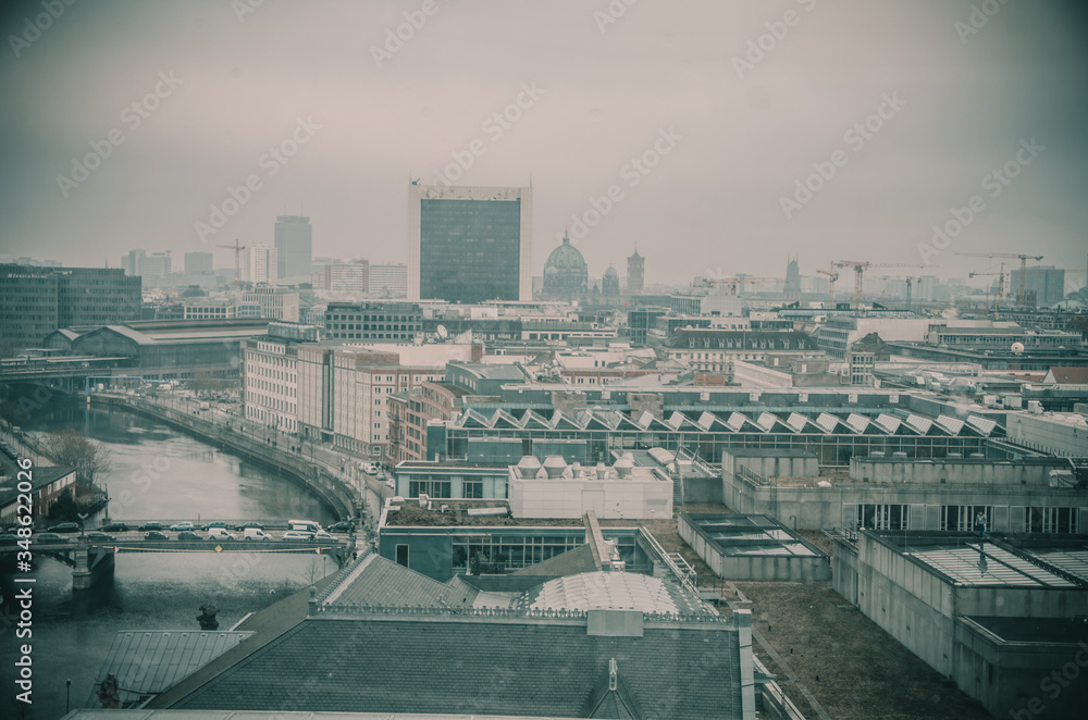 View of the city of Berlin from a window in the daytime, in winter