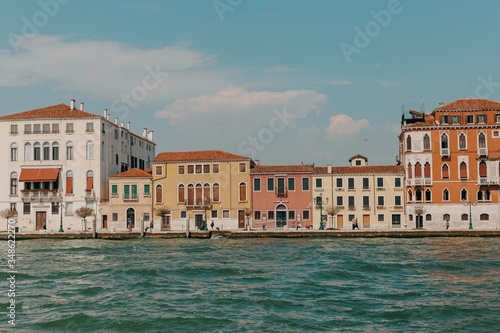 The beautiful, sunny streets of Venice, ancient buildings, canals and roofs © alexbutko_com