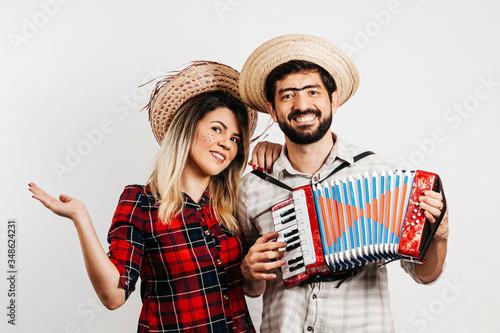 Brazilian couple wearing traditional clothes for Festa Junina - June festival