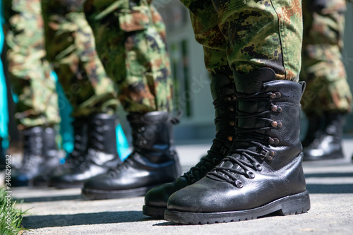 Military boots, soldiers standing in line