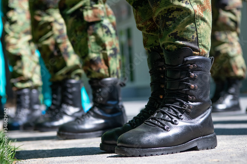 Fototapeta Naklejka Na Ścianę i Meble -  Military boots, soldiers standing in line