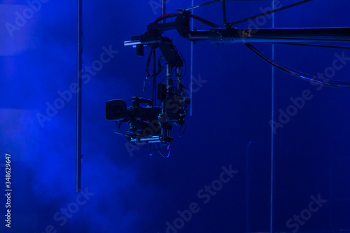 Camera crane with a camera in a television studio