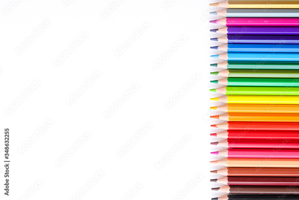 Colored pencils on the side on a white background. Colored pencils on the side on a white background.
