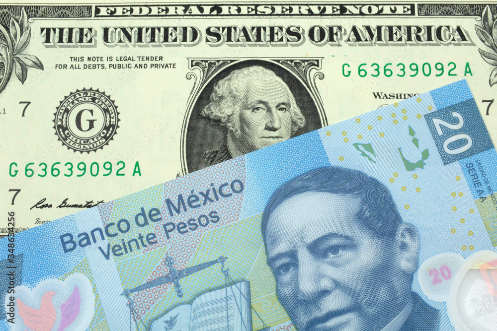 A close up image of a one American dollar note close up in macro with blue twenty Mexican peso bank note from Mexico