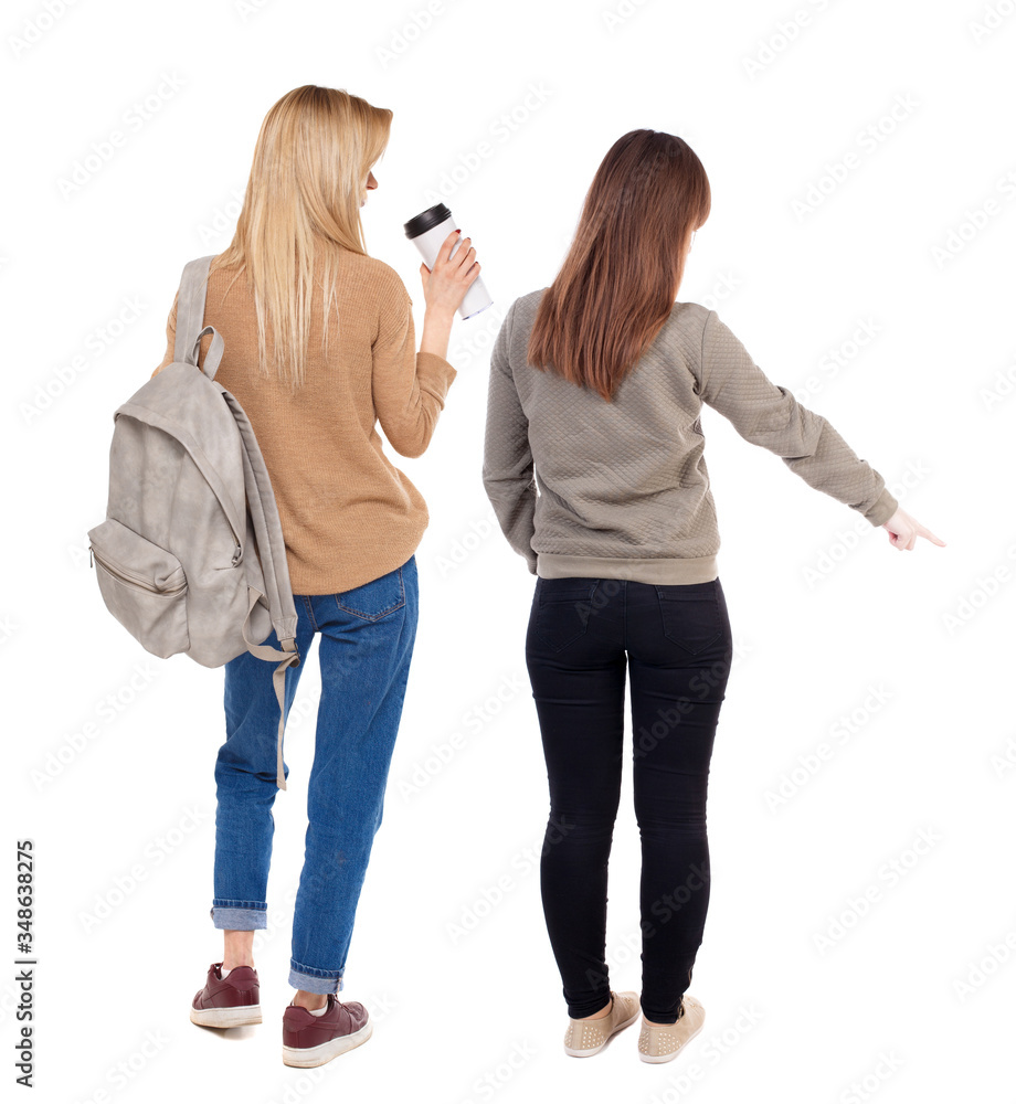 Back view of two pointing girl in sweater. Back view of two pointing girl in sweater.