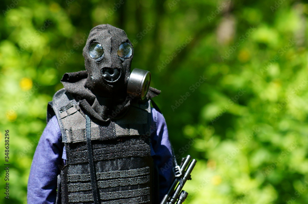 Toy soldier with a gas mask on a green background. Toy soldier with a gas mask on a green background.
