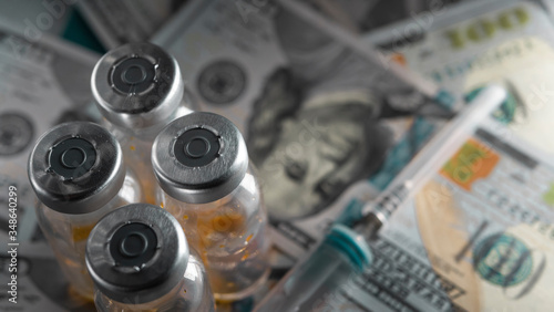 Drug smuggling.Vials of antibiotic, anti-virus tablets, and a syringe for injection. Buying or selling fake medicines that have not passed verification. Closeup. Template.