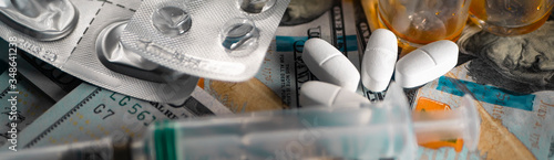 Drug smuggling.Vials of antibiotic, anti-virus tablets, and a syringe for injection. Buying or selling fake medicines that have not passed verification. Closeup. Template.