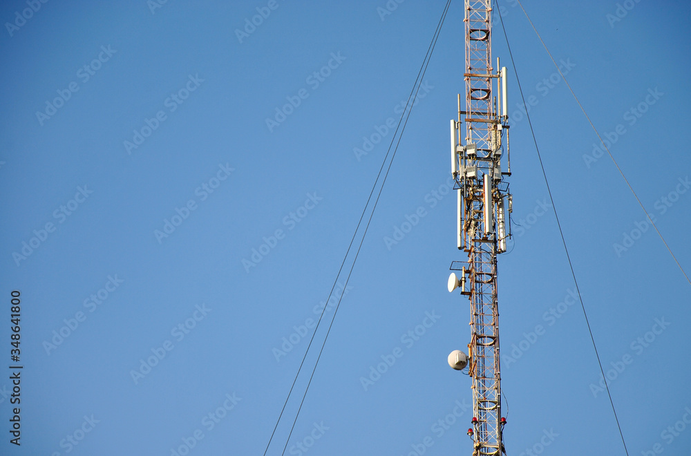 mobile communications tower on a background of blue sky and place for text
mobile communications tower on a background of blue sky and place for text