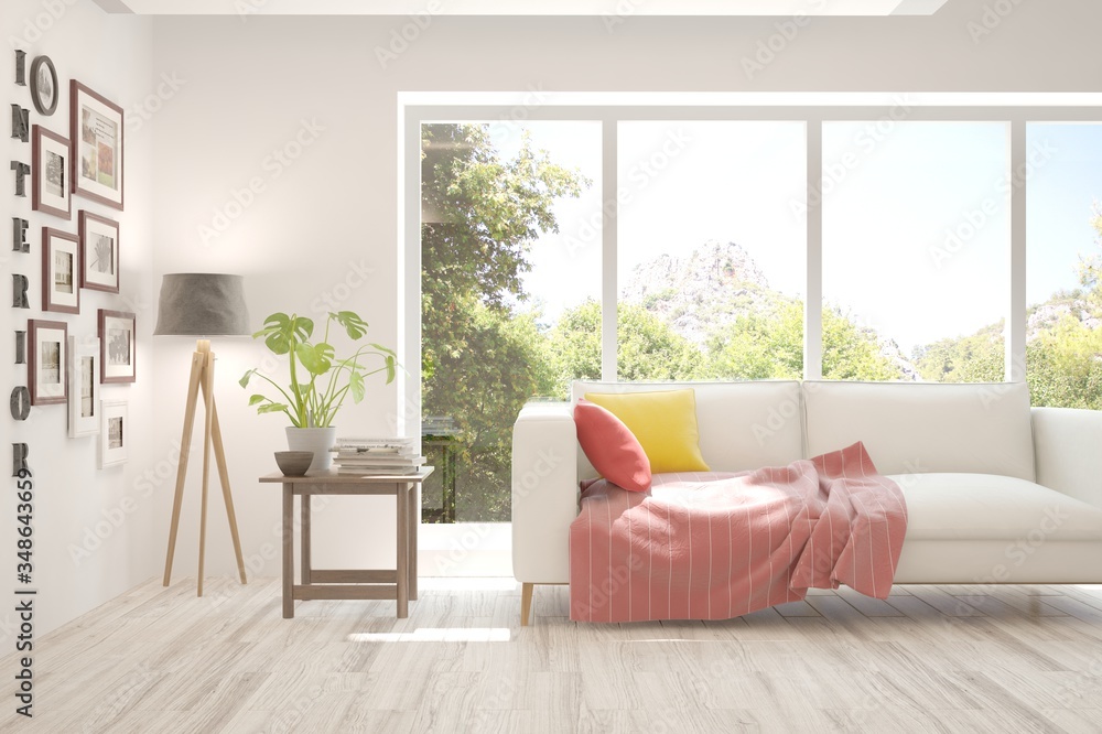 Fototapeta premium White living room with sofa and summer landscape in window. Scandinavian interior design. 3D illustration