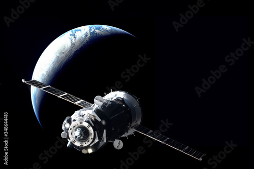 Fototapeta Naklejka Na Ścianę i Meble -  Russian manned spacecraft in orbit around the Earth. Elements of this image furnished by NASA.