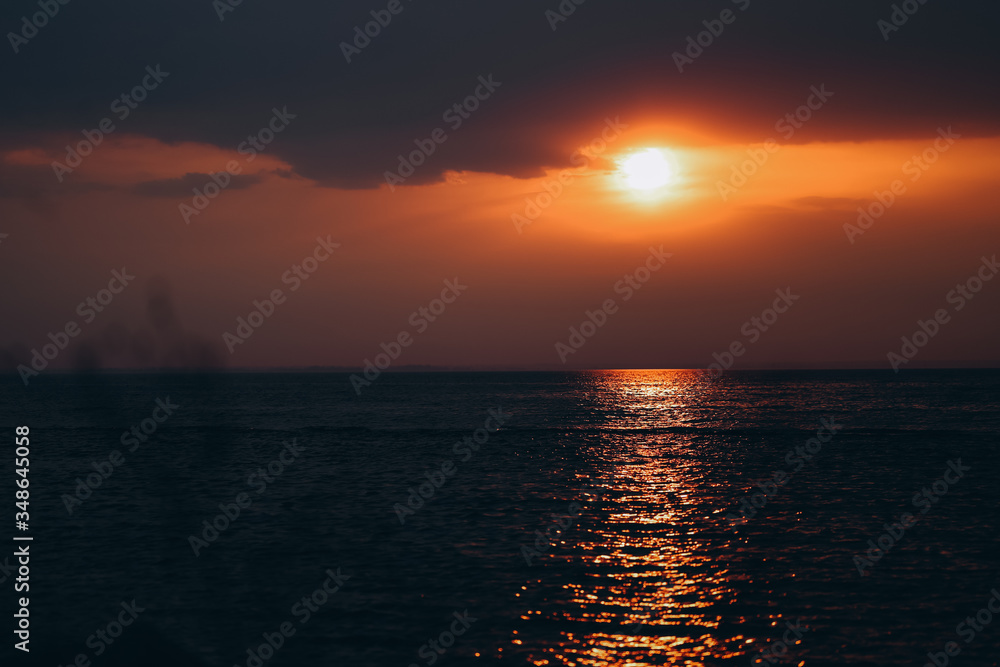 Beautiful orange sunset seaside dark colors