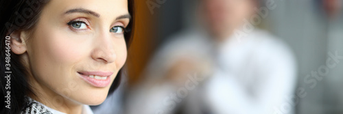 Quadro su tela Smiling woman turned around in front her man