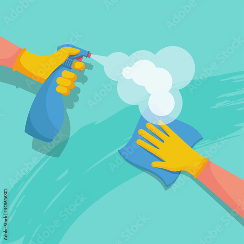 Surface cleaning in house. Spraying antibacterial sanitizing spray. Prevention coronavirus COVID-19. Bottle of disinfection and a rag in the hands of a cleaner. Medical blue gloves. Sanitize surfaces.