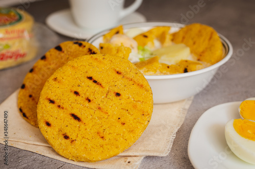 Egg broth with arepa of corn pelao. Typical Colombian breakfast (arepa Santandereana) photo