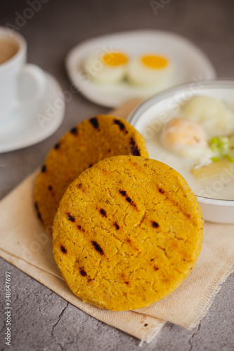 Egg broth with arepa of corn pelao. Typical Colombian breakfast (arepa Santandereana) photo