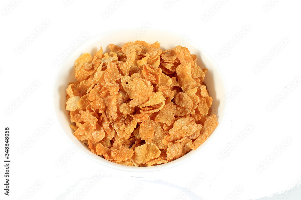 close up of muesli with dried fruits and yogurt in bowl on white background close up of muesli with dried fruits and yogurt in bowl on white background