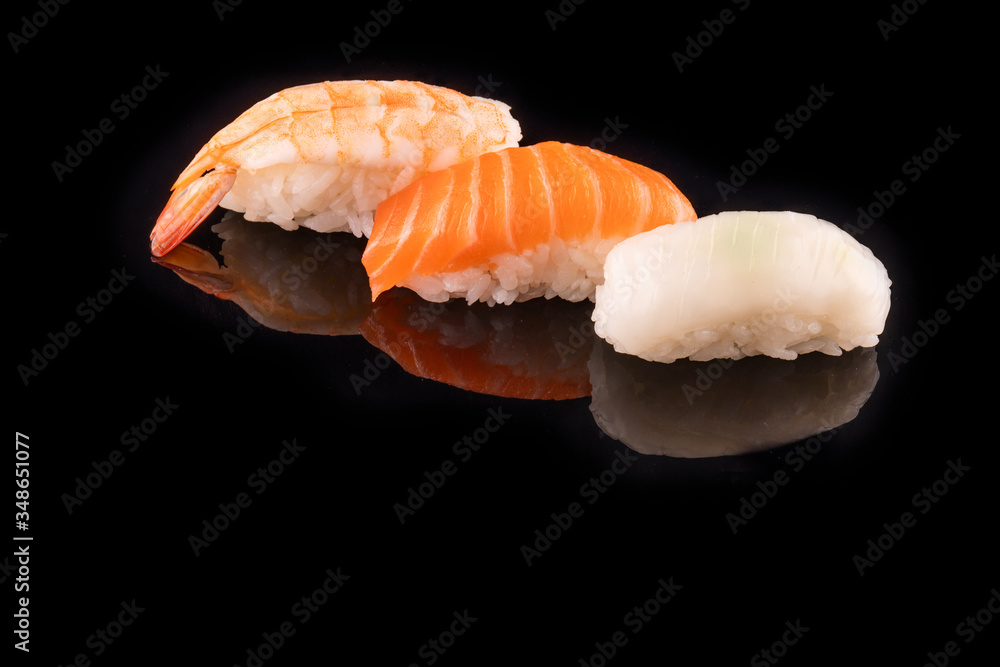 Simple sushi nigiri maki set isolated on black background. Various selection of traditional japanese Simple sushi nigiri maki set isolated on black background. Various selection of traditional japanese