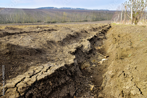 Landscape destruction field erosion of soil photo