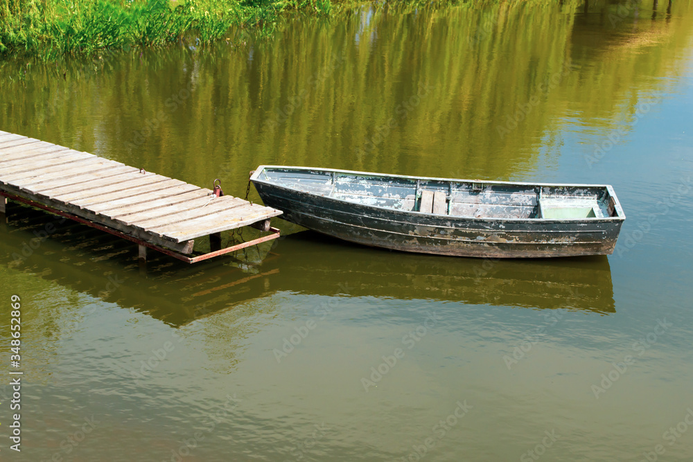 An old wooden boat in the river near
