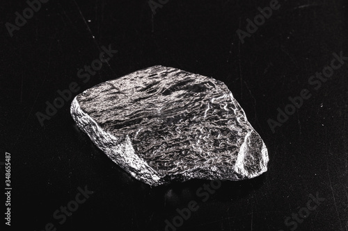 Platinum is a chemical element used in the chemical industry as a catalyst for the production of nitric acid, silicone and benzene. Crude platinum stone, industrial use. photo