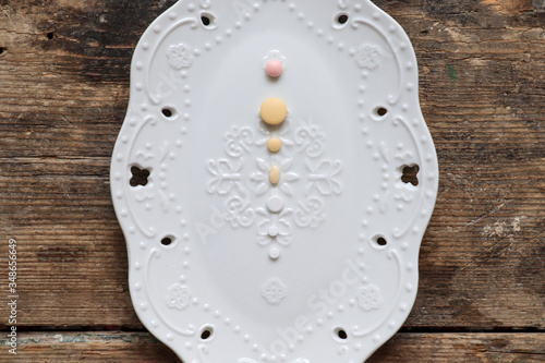 Pills on a white decorative plate