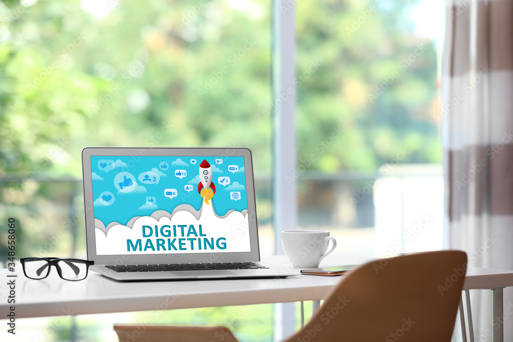 Digital marketing concept. Modern laptop on table indoors Digital marketing concept. Modern laptop on table indoors