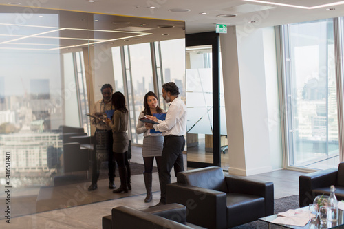 Business people talking in office photo