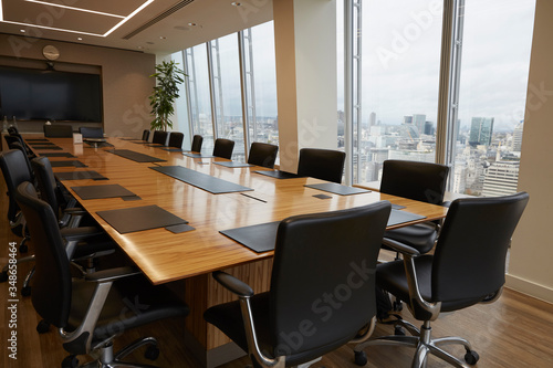 Modern conference room table overlooking city photo