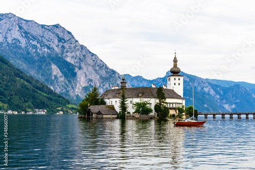 Castle Ort in Gmunden on Traunsee (lake Traun) with boats, Sailboats in  Salzkammergut nearby Salzburg, Traunkirchen,  Austria. Beautiful postcard view.