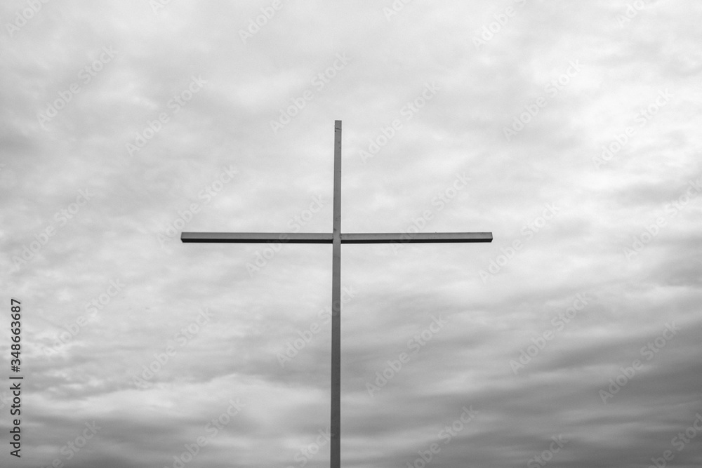 big cross with sea on the background