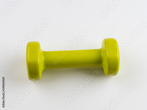 A small green dumbbell on white background