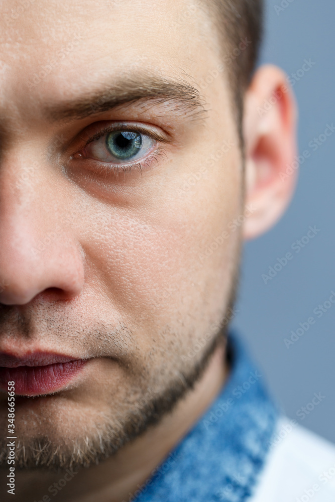 Obraz premium Closeup portrait of a man in a white polo on a white background. Male image for every day. Stylish guy