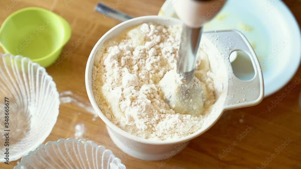 Woman mixing ingredients for pastry Woman mixing ingredients for pastry