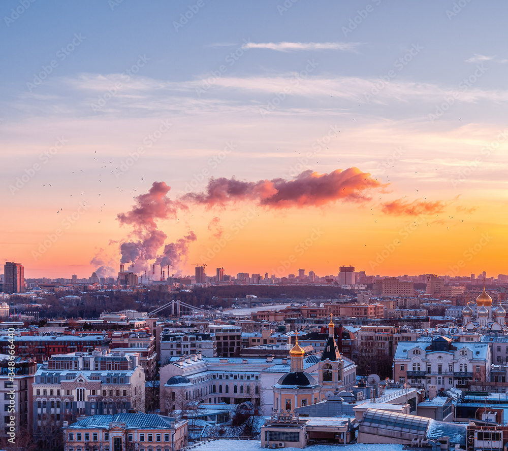 cityscape at sunset. Smoke from the pipes. Gorky park from the observation deck of the Cathedral of Christ the Savior.